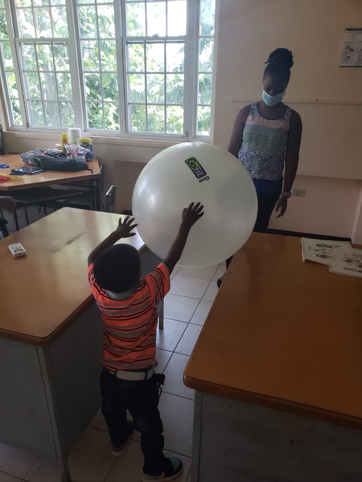 Small child working with occupational therapist