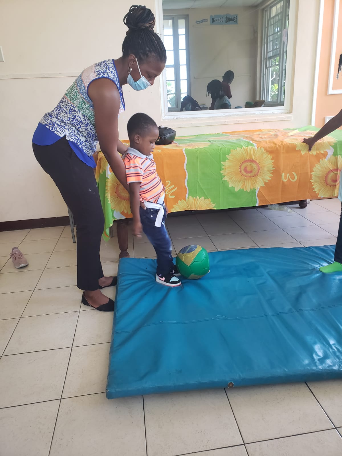 Occupational therapist working with small child