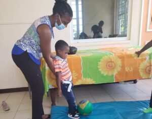 Occupational therapist working with small child